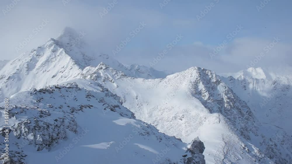 Panoramic view of Alps. Tops of mountains. Above clouds Panoramic view of Alps. Tops of mountains. Above clouds