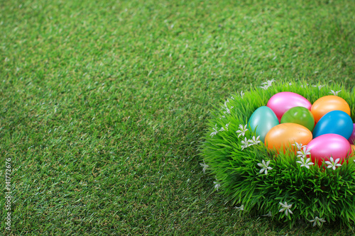 Easter eggs on meadow