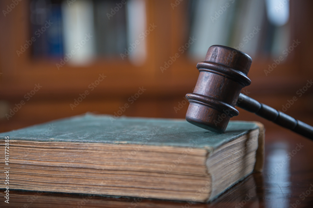 Law Concept. Judges Gavel And Scale Of Justice. wooden desk, books Law Concept. Judges Gavel And Scale Of Justice. wooden desk, books