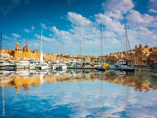 yachts near pier in Birgu near Cospicua in Malta with reflection