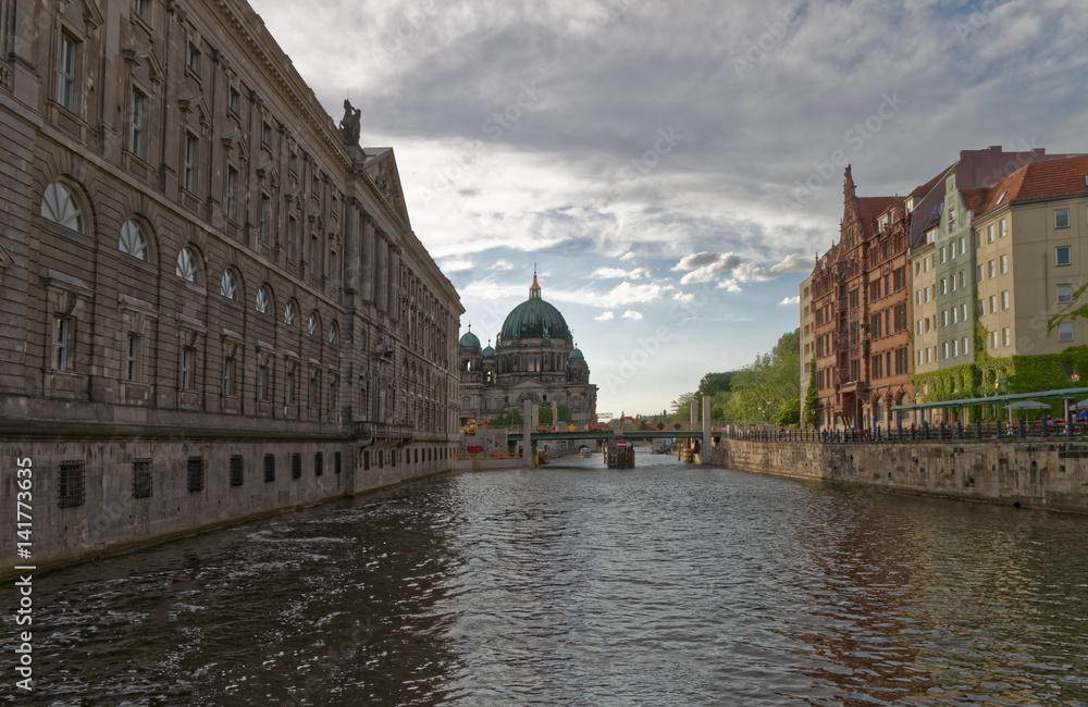 Water canal in Berlin, with cathedral in the background.
