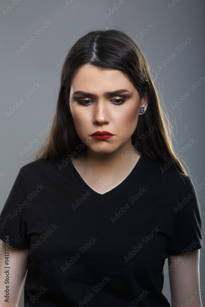 Sad woman looking down Sad woman looking down