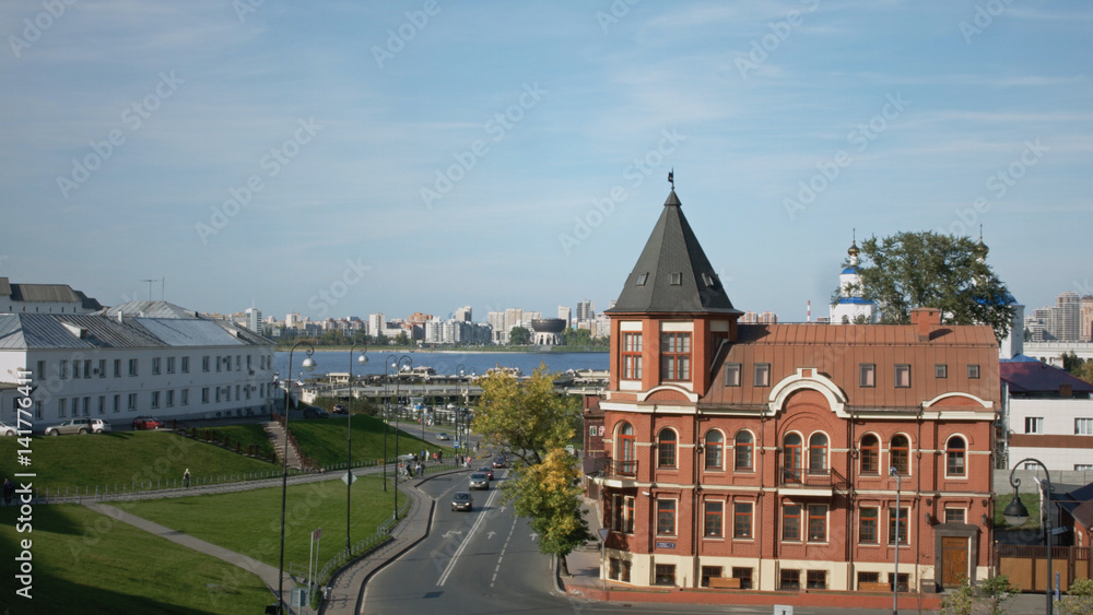 Summer city landscape with a river and a beautiful old house. Kazan, Russia