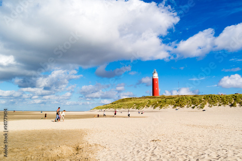 Lighthouse and beach of De Cocksdorp on Texel island, Netherlands photo