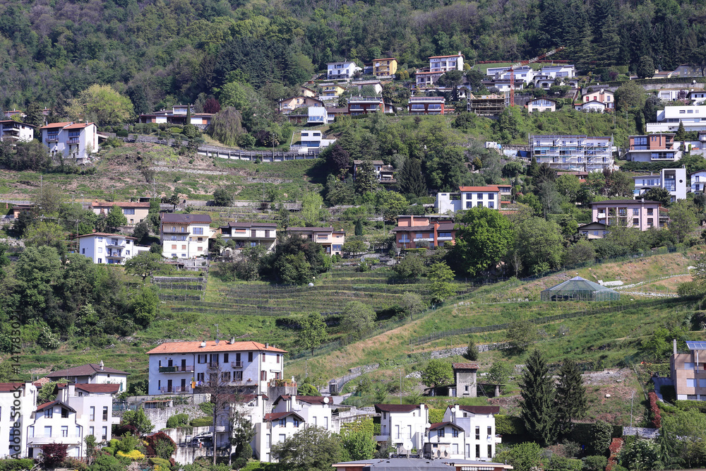 village with traditional stone houses scattered on the mountain side,