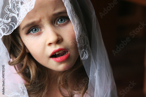 Little girl in wedding veil