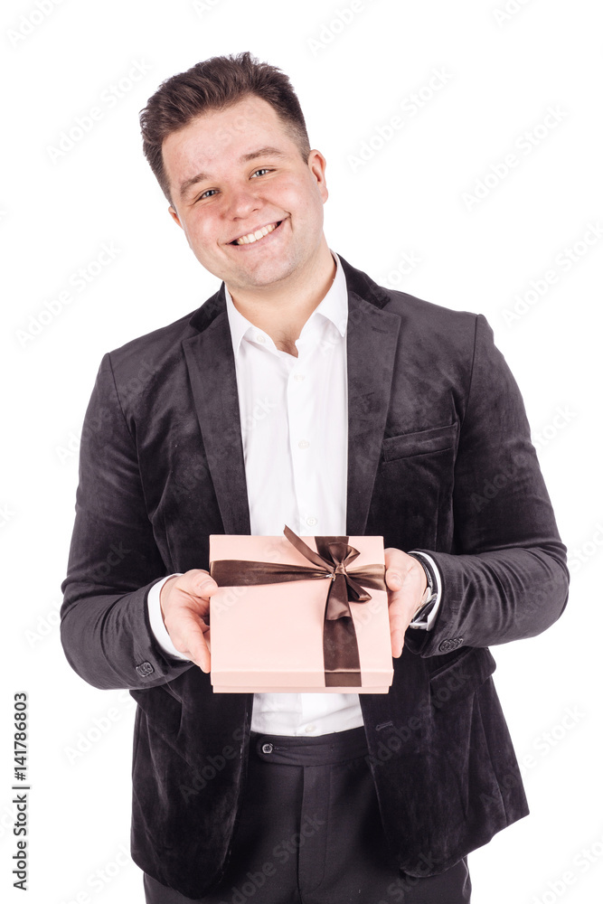 man opening a surprise gift box with a bow with a look of joyful anticipation as he celebrates man opening a surprise gift box with a bow with a look of joyful anticipation as he celebrates