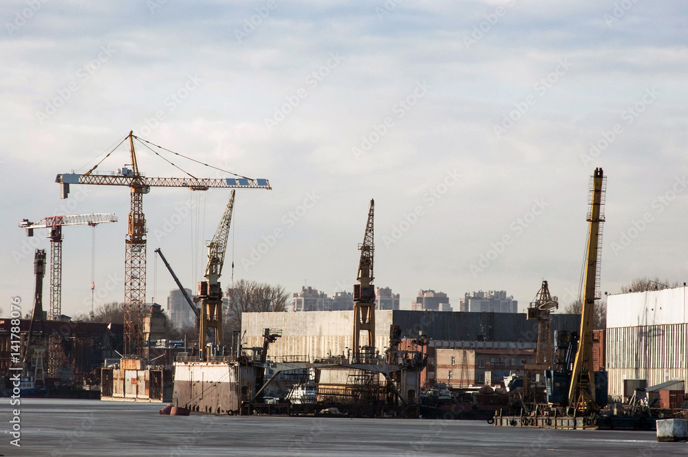 City industrial landscape. This is an industrial part of the city, factories, a port, the construction of new buildings. City industrial landscape. This is an industrial part of the city, factories, a port, the construction of new buildings.