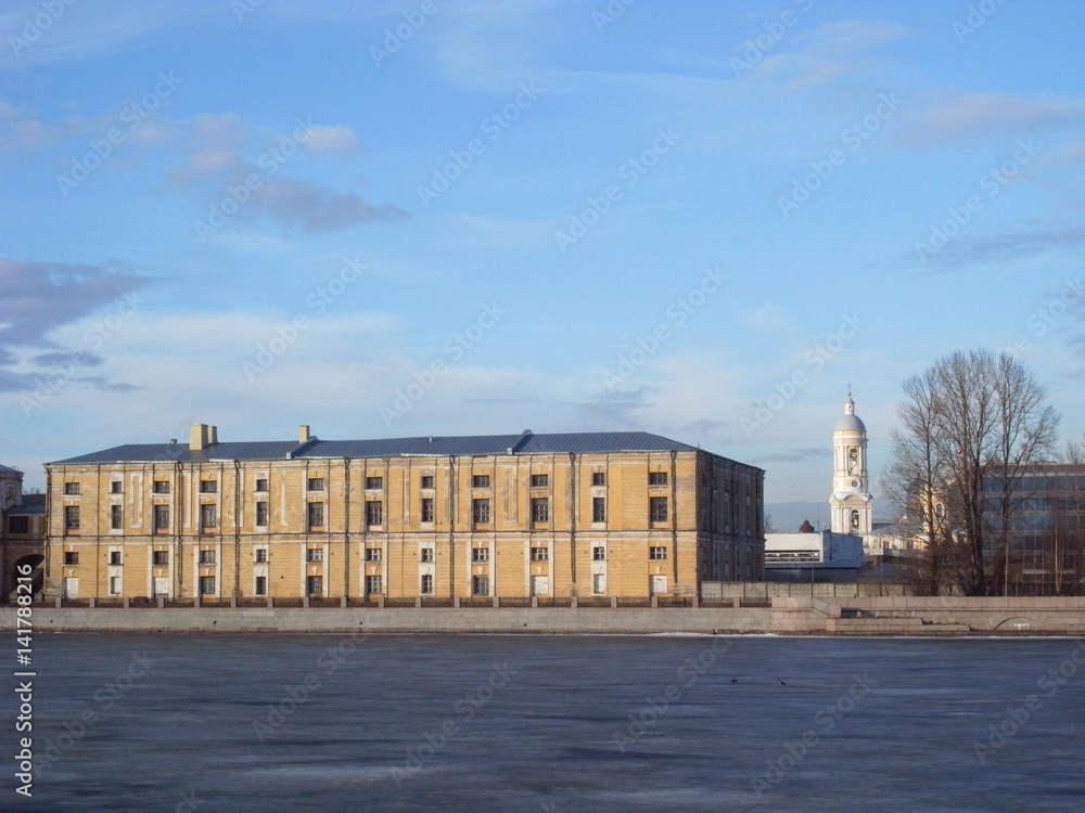 Fototapeta premium The building of the Military-Space Cadet Corps named after Peter the Great. The majestic building is reflected in the Neva
