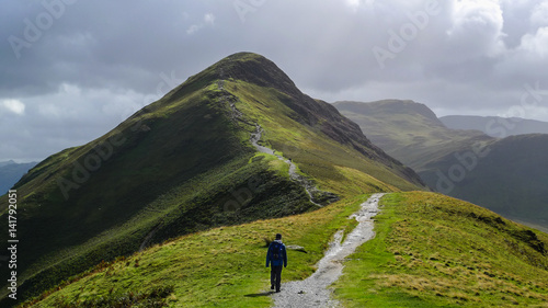 Hiking trail in the mountain landscape of Catbells hill top in Lake District, England