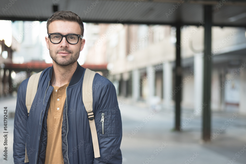 Fototapeta premium man with backpack smiling student