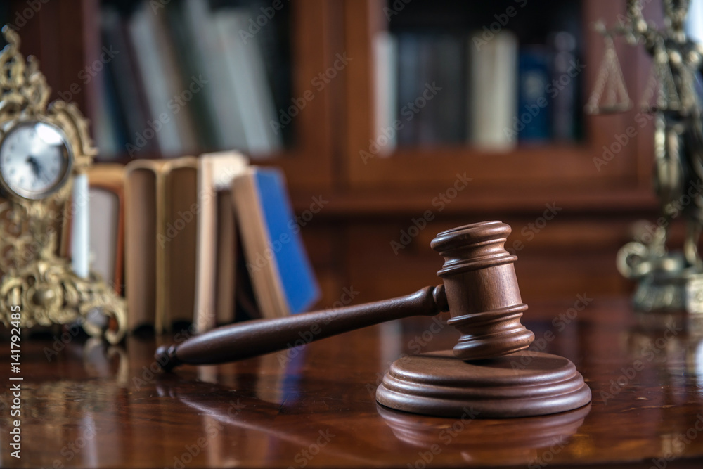 Law and Justice concept with gavel and scale in background. Composition in court library Law and Justice concept with gavel and scale in background. Composition in court library