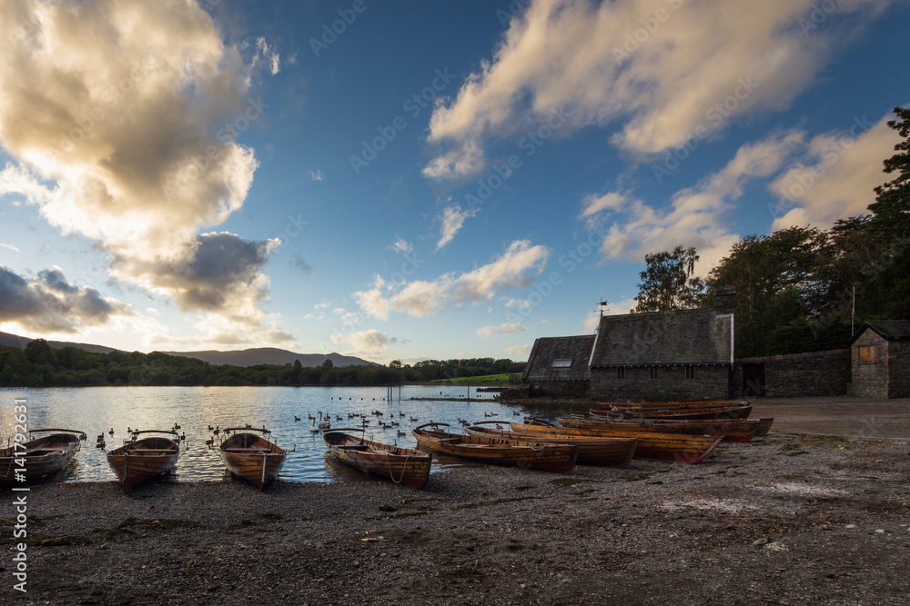 Sunset over wooden boats on the shores of Derwentwater at Keswick, England,UK
