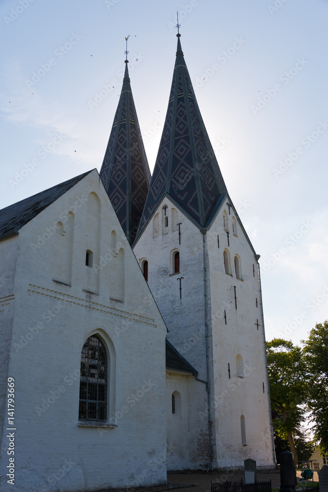 white medieval church in rural denmark white medieval church in rural denmark