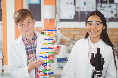 Photography Portrait of school kids experimenting molecule