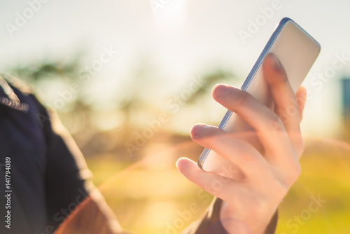 Hand holding phone close-up