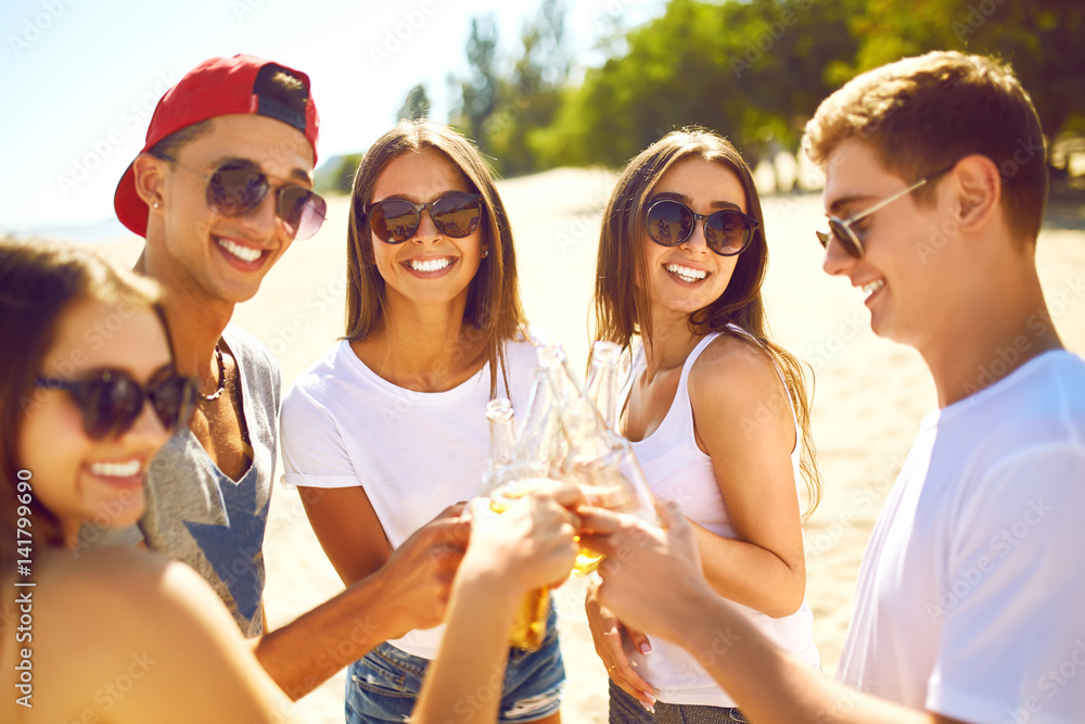 Group of friends hanging out with beer at the beach. Excellent sunny weather. Beautiful figures. Super mood. Summer concept
Group of friends hanging out with beer at the beach. Excellent sunny weather. Beautiful figures. Super mood. Summer concept