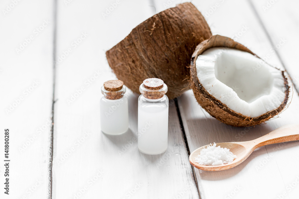 fresh coconut with cosmetic oil in jar on white background mock up fresh coconut with cosmetic oil in jar on white background mock up
