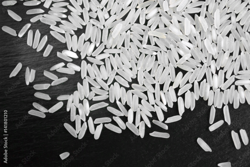 Hill rice grains on a black background, close-up Hill rice grains on a black background, close-up