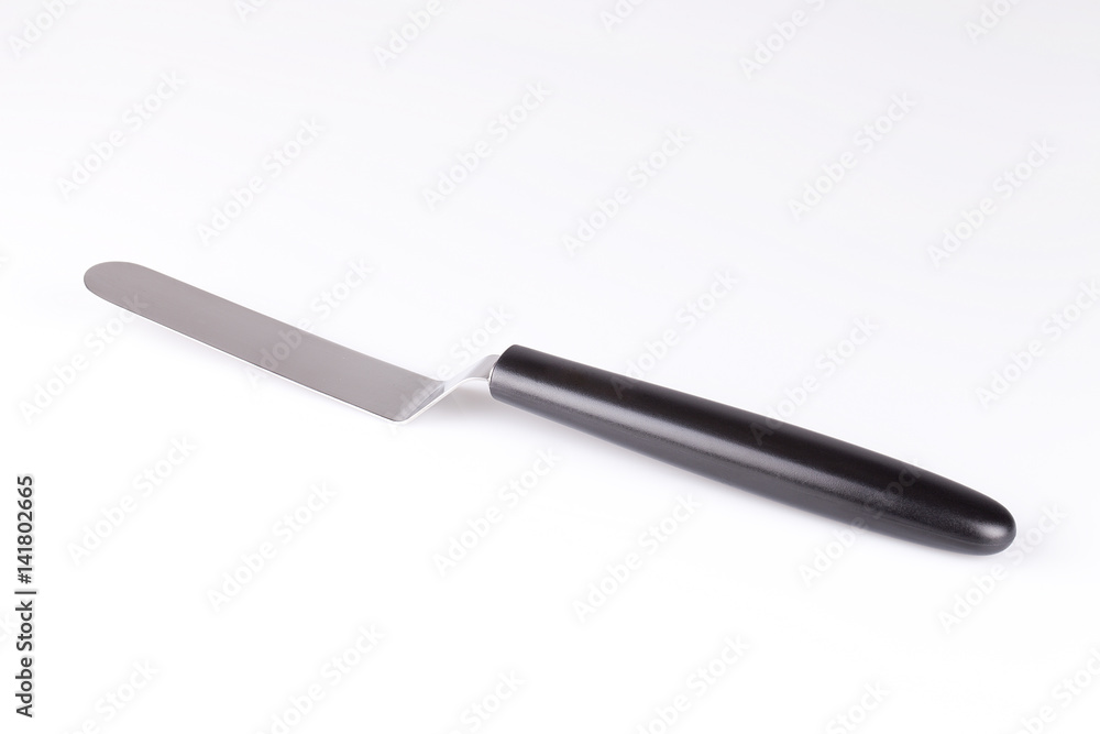Pancake spatula / cake spatula on shite surface. Isolated on white background. Pancake spatula / cake spatula on shite surface. Isolated on white background.