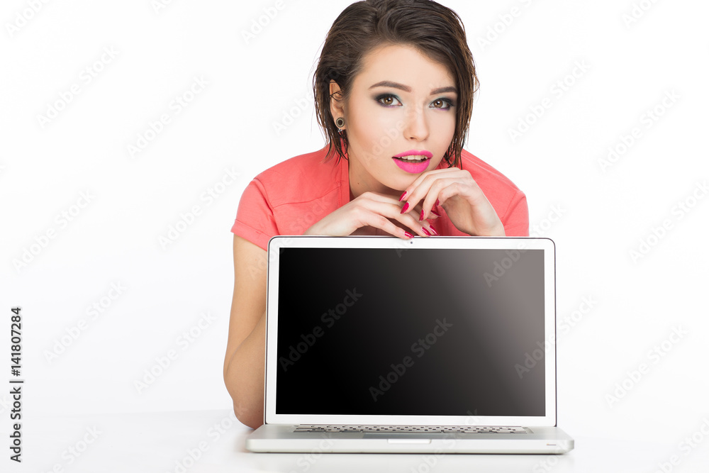 Young model on the white background with laptop. Young model on the white background with laptop.