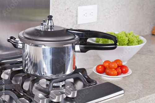 фотографія double valve pressure cooker, in a Kitchen setting