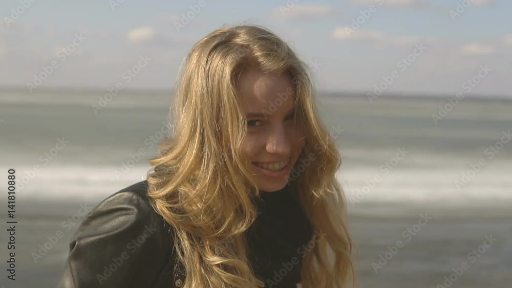 Beautiful blonde girl with braces on teeth smiling and looking at camera. Beautiful blonde girl with braces on teeth smiling and looking at camera.
