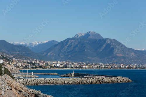 View of Alanya with marina in sharp focus and city and mountains