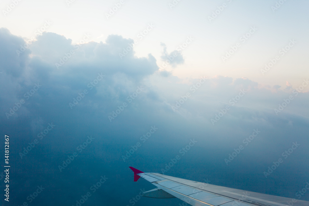 View from plane window, cloud sky