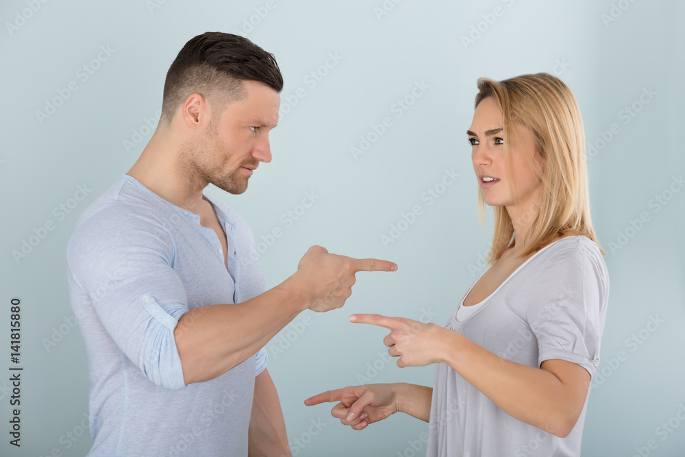Couple Pointing At Each Other Couple Pointing At Each Other