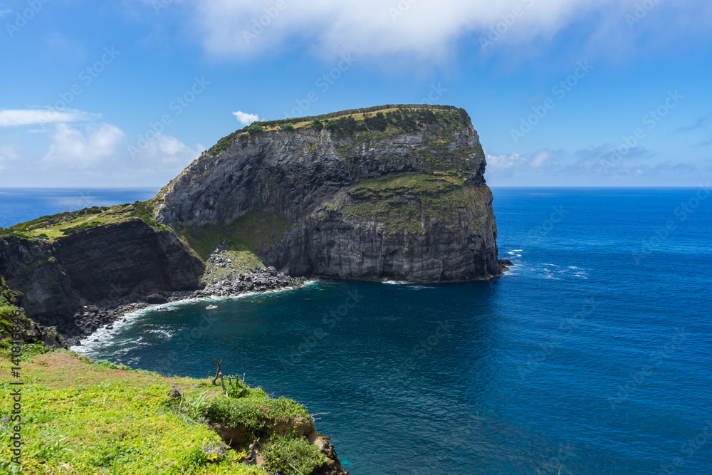 Morro do Castelo Branco, a scenic old rock overlooking the sea in Faial Island, Portugal, Azores