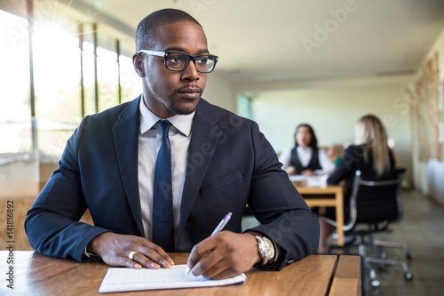 Company workshop focus on handsome male african american businessman sitting at table meeting