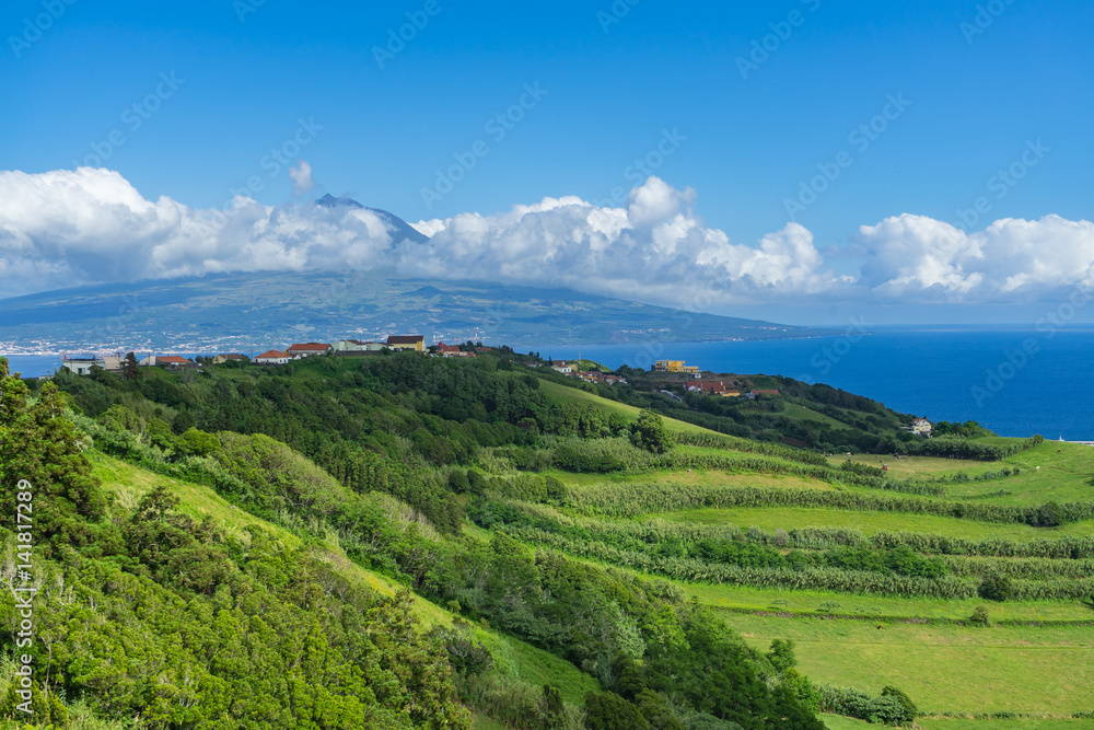 Scenic view of Mount Pico surrounded by clouds from Faial Island, Azores, Portugal