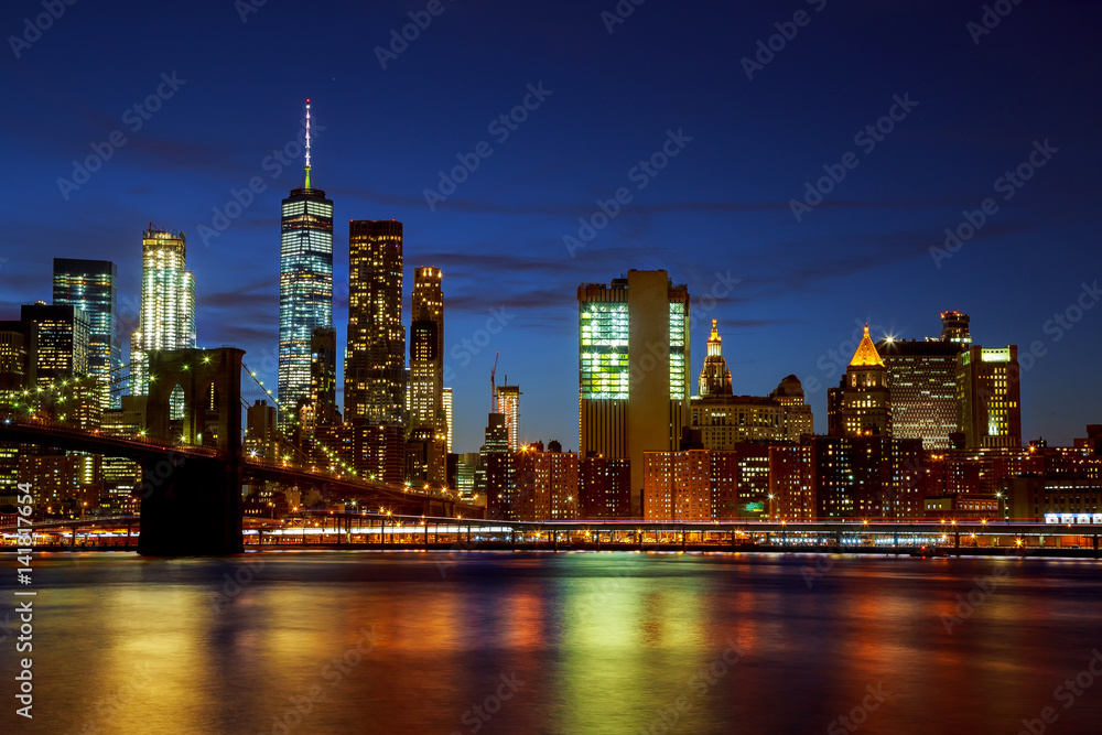 New York City's Brooklyn Bridge and Manhattan skyline illuminated