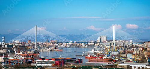 Panorama of the city of Vladivostok. View of the Golden Horn Bay and the Golden Bridge