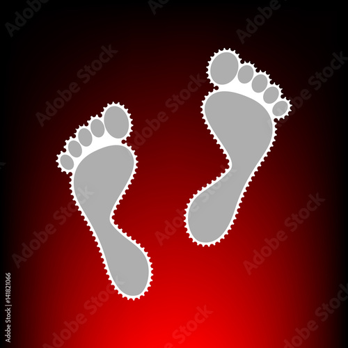 Foot prints sign. Postage stamp or old photo style on red-black gradient background.