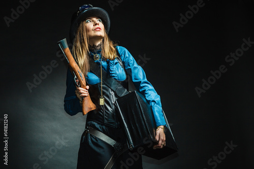 Vintage girl with gun.