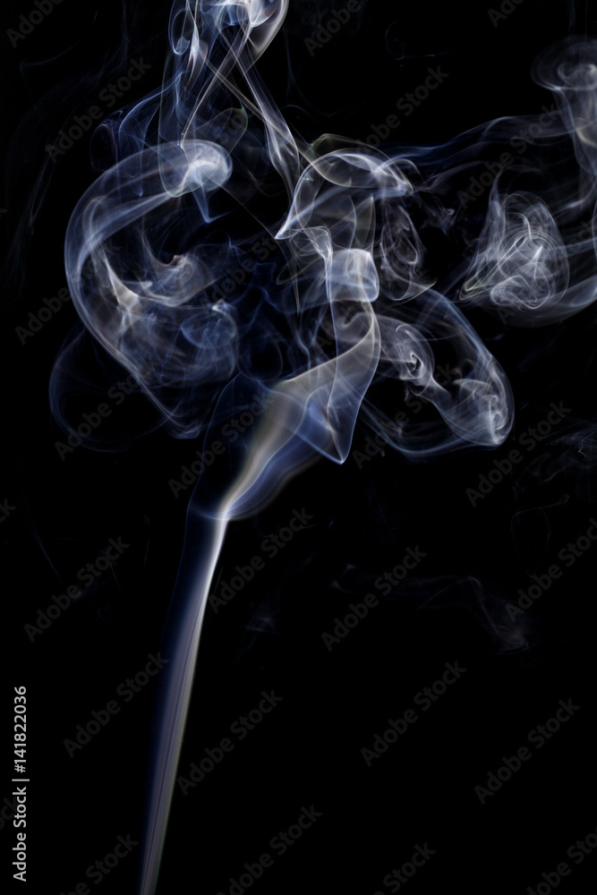 Abstract art. Color white blue smoke from the aromatic sticks on a black background. Background for Halloween. Texture fog. Design element. The concept of aromatherapy. Abstract art. Color white blue smoke from the aromatic sticks on a black background. Background for Halloween. Texture fog. Design element. The concept of aromatherapy.