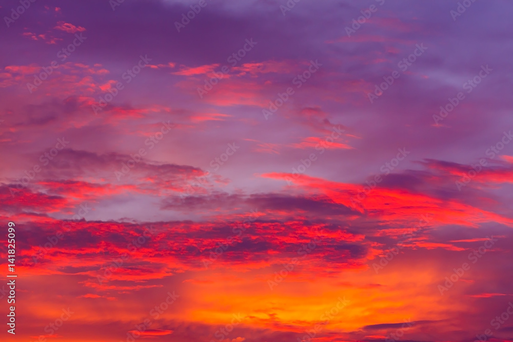 Nature background. Red sky at night and clouds. Beautiful and colorful sunset time.