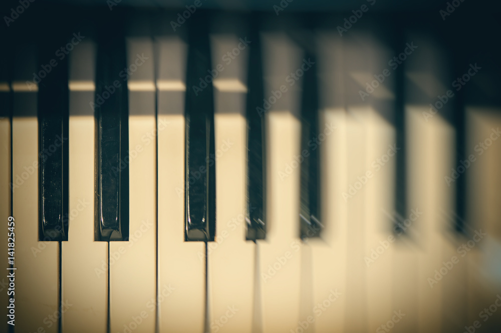 Piano keyboard background with selective focus and blur. Blur keyboard and musical notes Piano keyboard background with selective focus and blur. Blur keyboard and musical notes