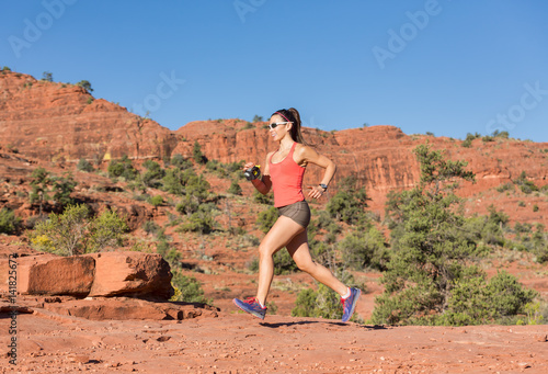 Woman Trail Running Outside in Desert