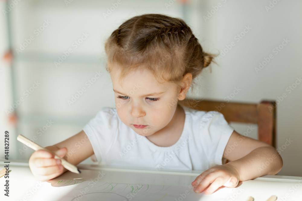 pretty little girl draws with pencils, indoor pretty little girl draws with pencils, indoor