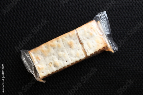 Biscuit in the sealed plastic packaging represent the confectionary concept related idea.