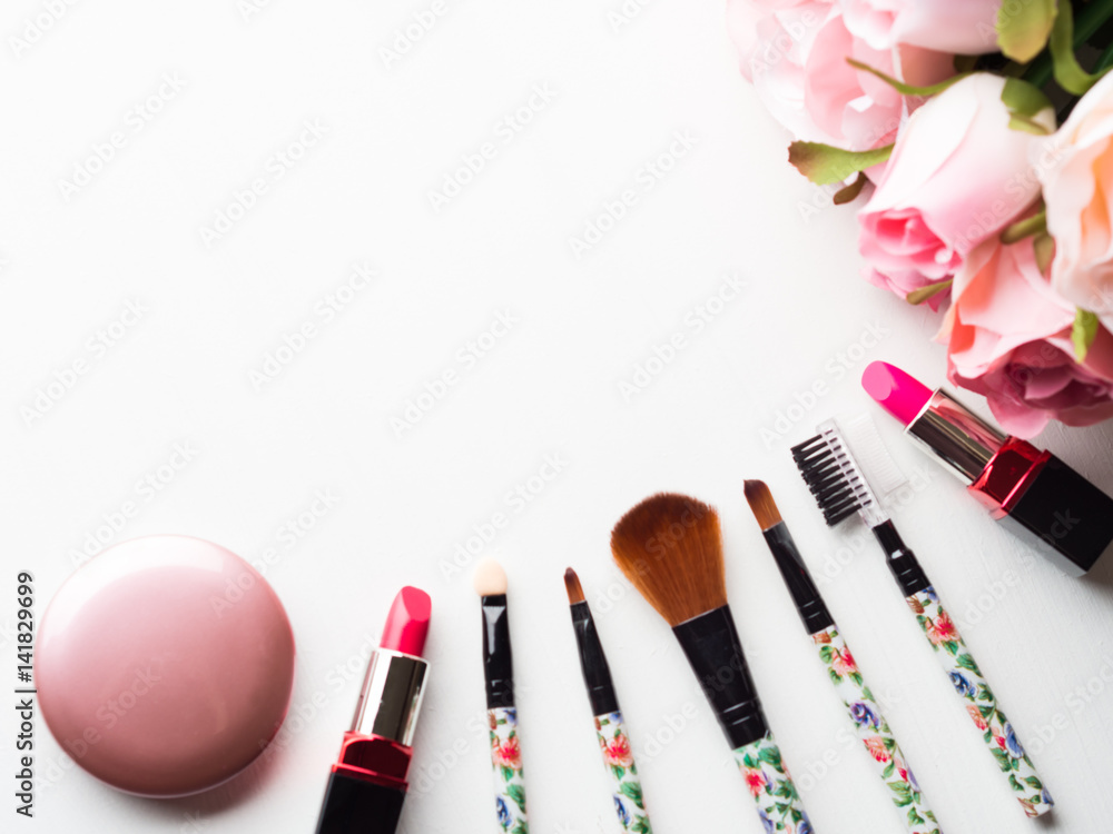 Make Up Products And Tools With Pink Roses Flowers On White Stock