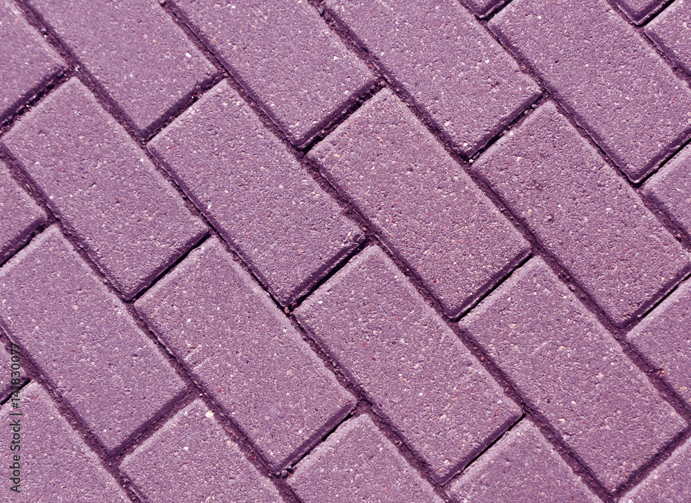 Violet color cobblestone pavement close-up Violet color cobblestone pavement close-up