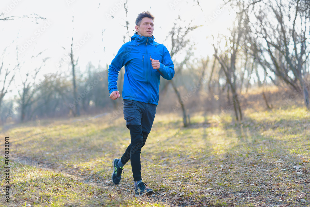 Early morning run in the park on a chilly day
