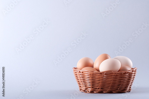 Eggs in a basket on a gray background
