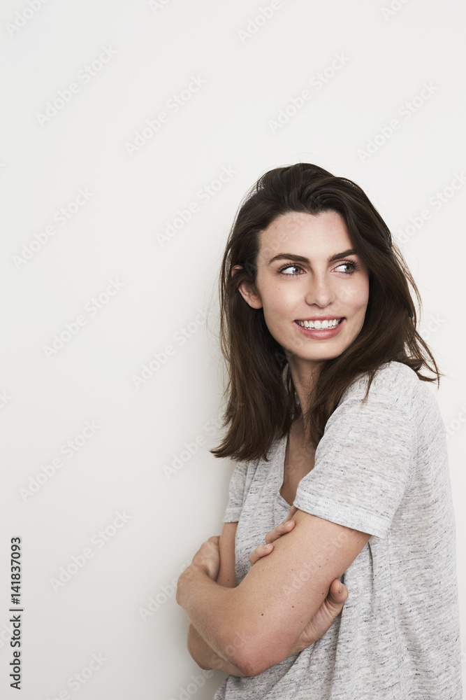 Beautiful woman in grey t-shirt, looking away Beautiful woman in grey t-shirt, looking away
