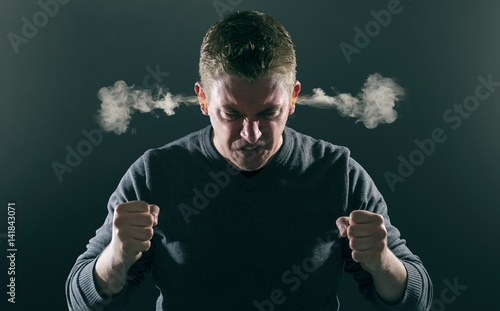 Slika na platnu Wütender Mann mit rauchenden Ohren