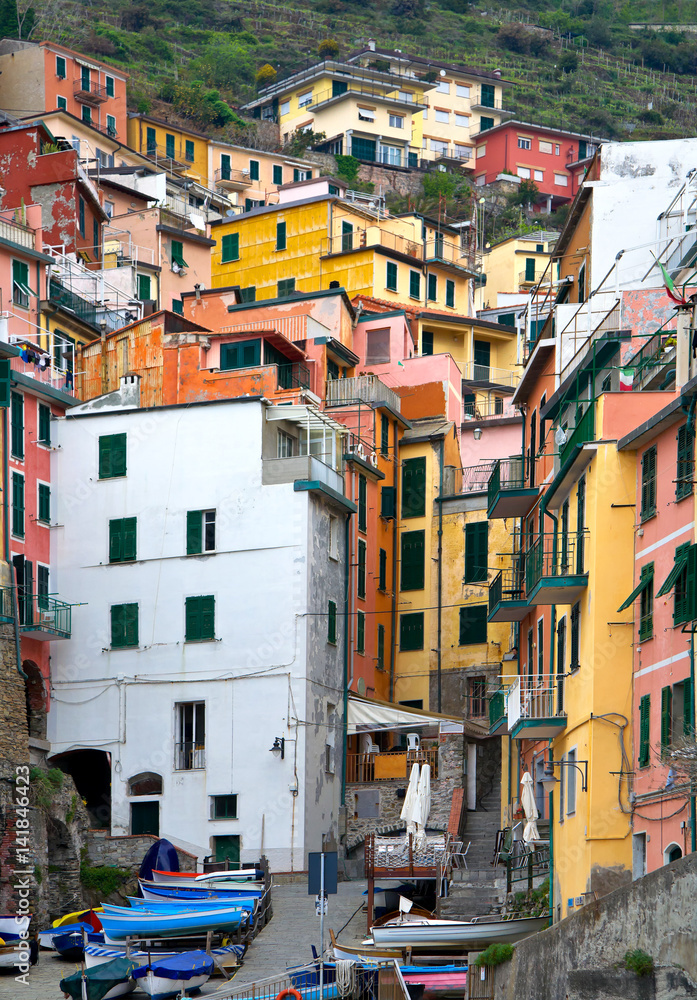 Italy. Narrow streets of the fishing village of Riomaggiore on the coast of the Ligurian Sea. Unusual cityscape